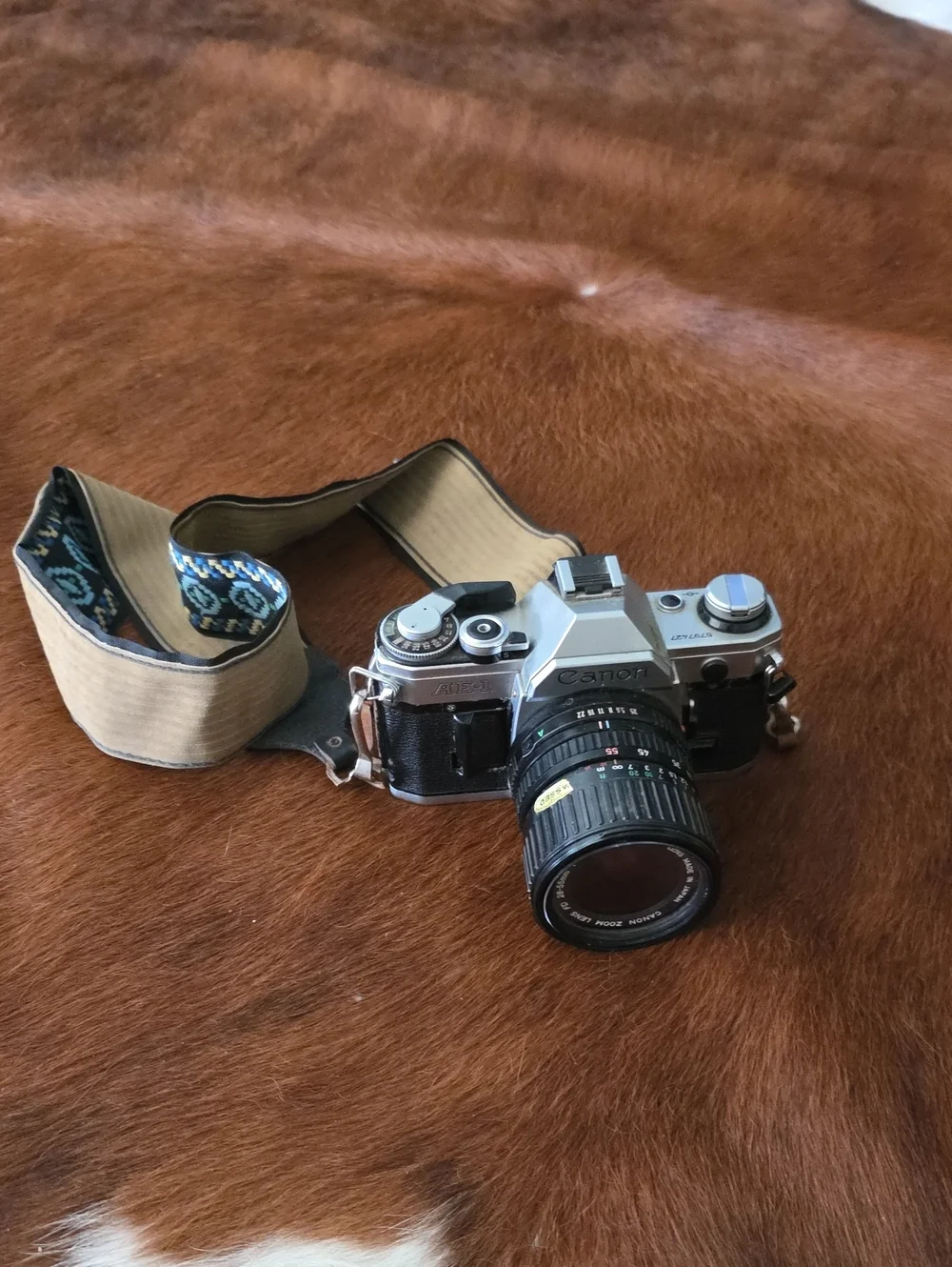 Canon 35mm Film Camera in Silver and Black with Tan Patterned Strap Vintage